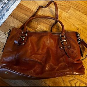 Large leather bag that fits a laptop.